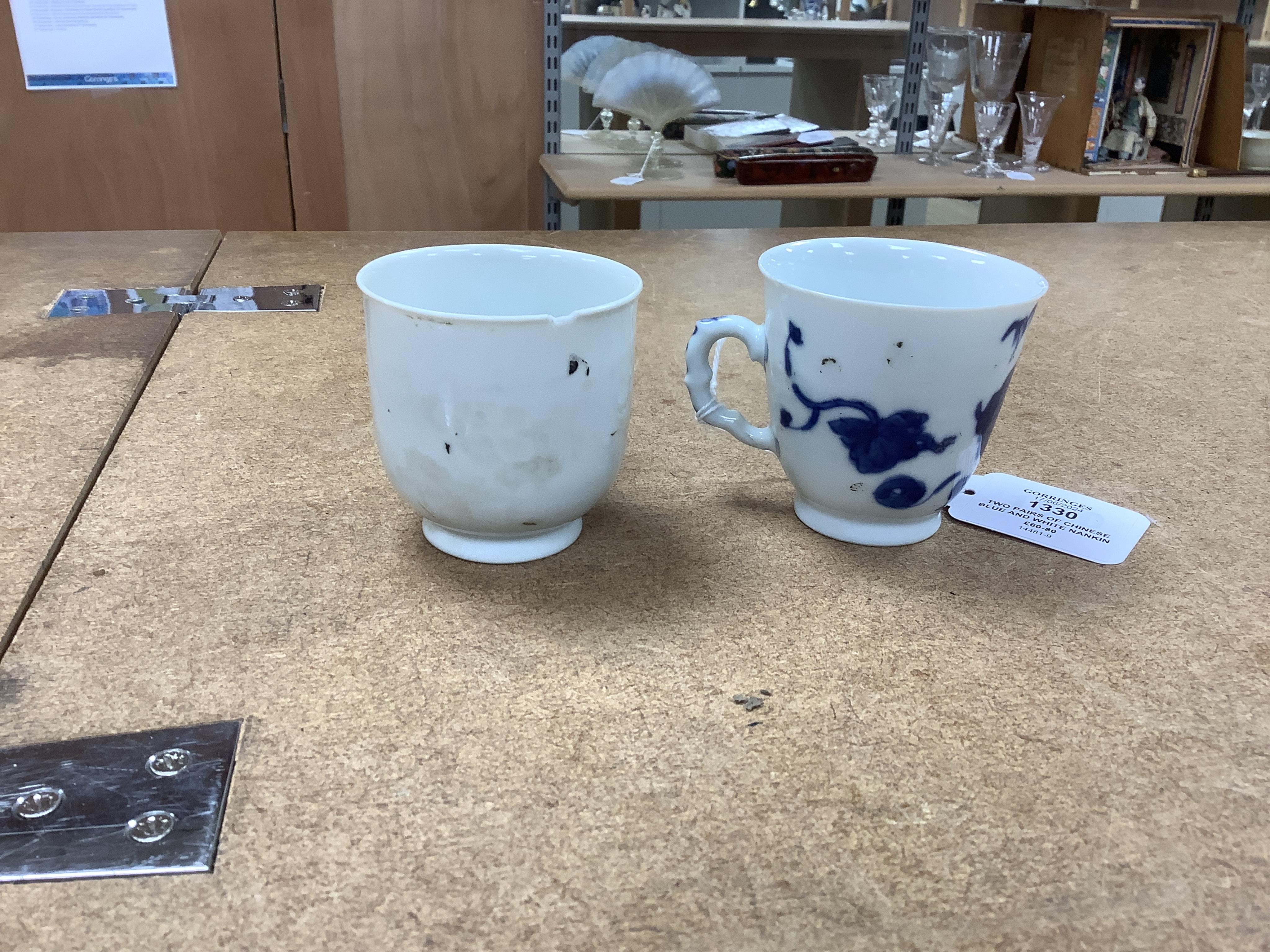 Two pairs of Chinese blue and white Nanking Cargo teabowls and saucers together with two other Chinese tea cups